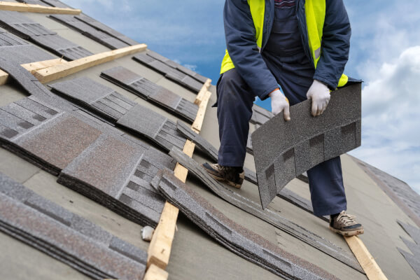 workman-install-tile-on-roof-of-new-house-under-construction